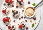 High-Protein Frozen Yogurt Bites, Five-ingredient high-protein frozen yogurt bites served on a summer-themed plate
