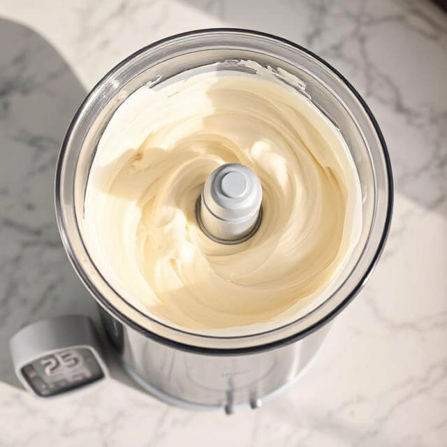 Protein ice cream in airtight container being transferred to freezer for final 2-4 hour freeze"